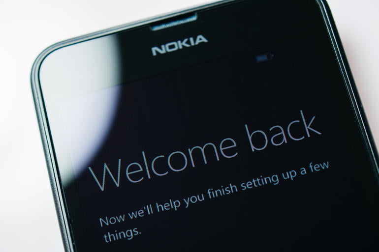 London, United Kingdom - August 24, 2014: Nokia Lumia Windowsphone smartphone display with Welcome Back text. Microsoft has announced that it will stop using Nokia branding on all future mobile phones