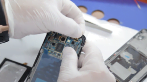 technician at the lab repairing cellolar obile phone eqty2j5ne F0000